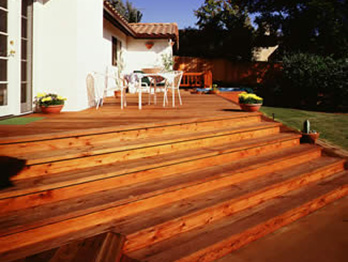 Knotty Construction Heart decking is used for the deck and steps on this Spanish style home.

